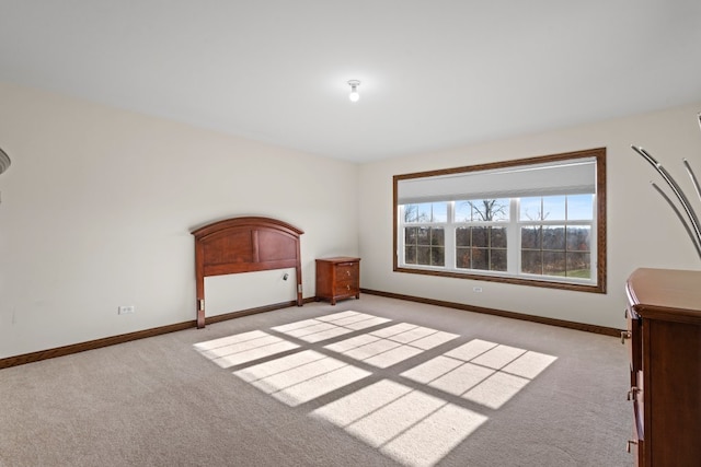 unfurnished bedroom featuring light colored carpet