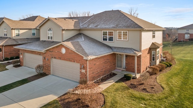 view of property with a front lawn and a garage