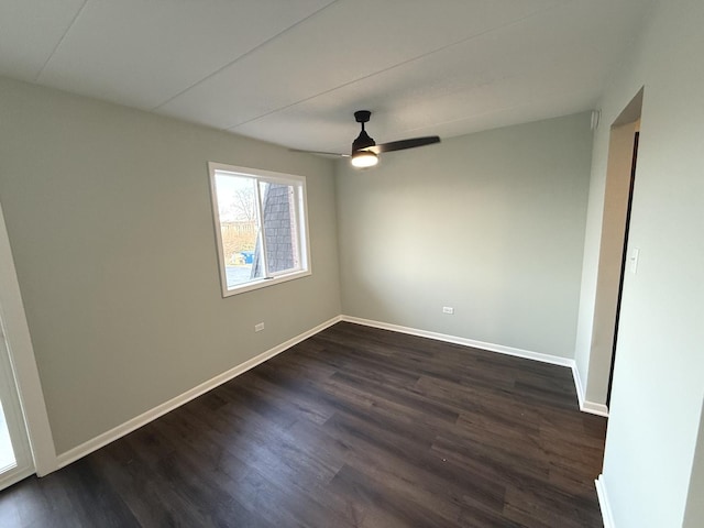 unfurnished room with ceiling fan and dark hardwood / wood-style floors