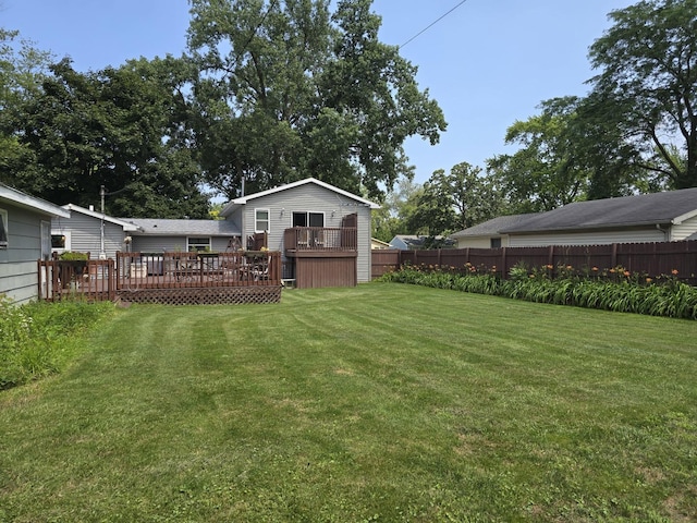 view of yard with a wooden deck