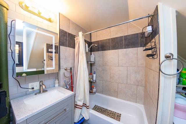 full bathroom with decorative backsplash, vanity, toilet, and shower / bath combo with shower curtain