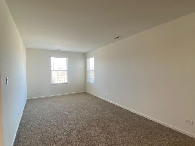 unfurnished room featuring carpet floors