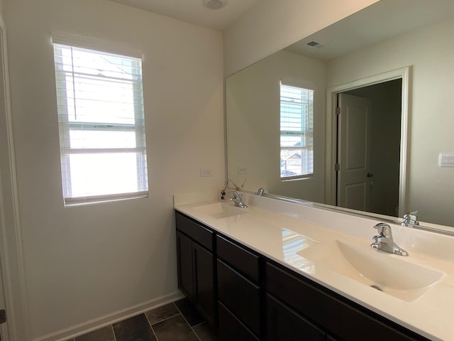 bathroom with tile patterned flooring and vanity