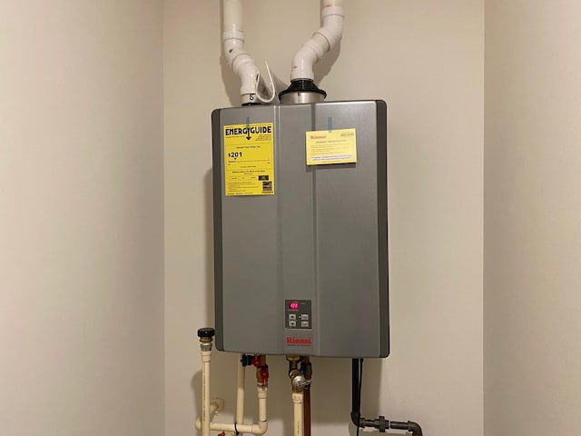 utility room with water heater