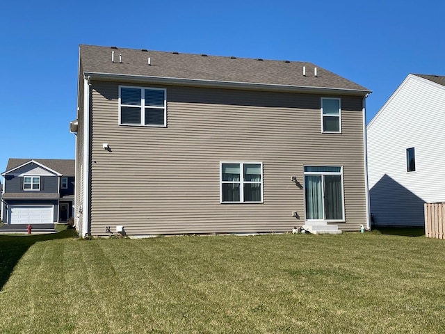 back of house featuring a yard