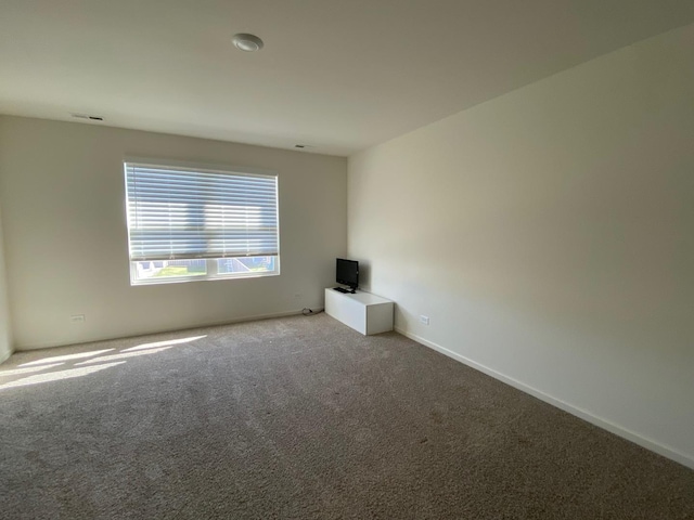 unfurnished room featuring carpet floors