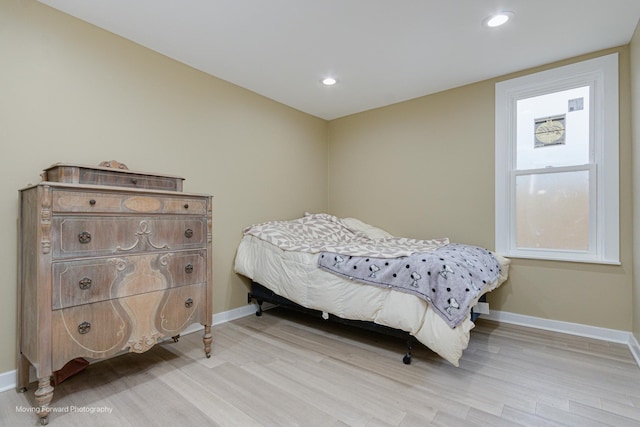 bedroom with light wood-type flooring