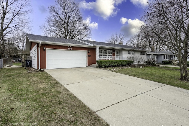 ranch-style home with a garage and a front lawn