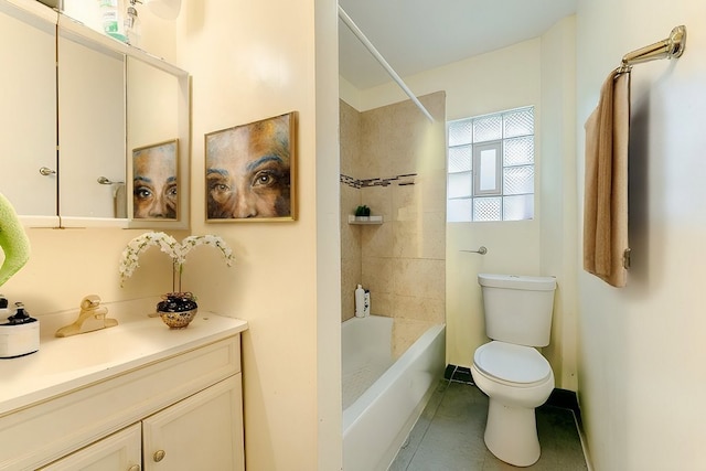 full bathroom featuring vanity, tile patterned flooring, tiled shower / bath, and toilet