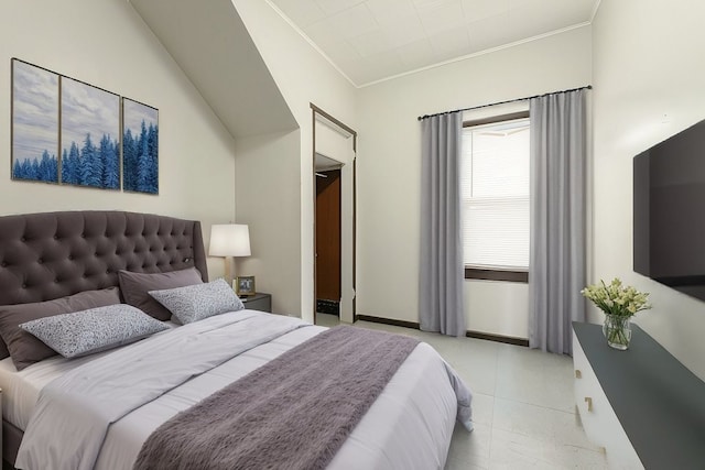 bedroom with vaulted ceiling and crown molding