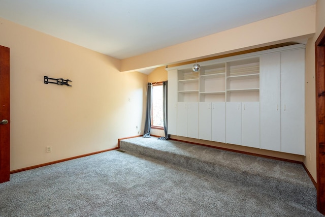 unfurnished bedroom featuring carpet and a closet