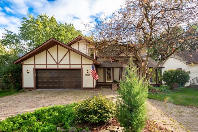 tudor-style house with a garage