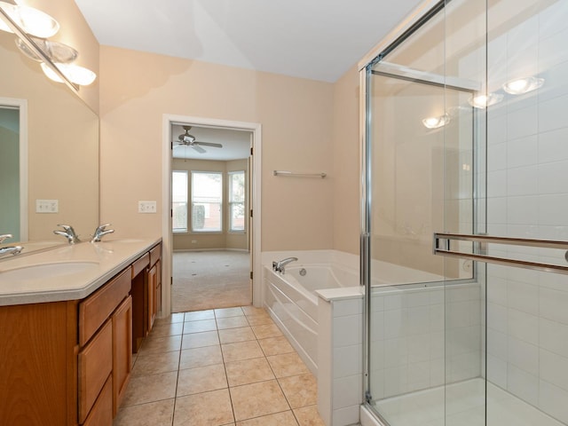 bathroom with tile patterned flooring, vanity, and independent shower and bath