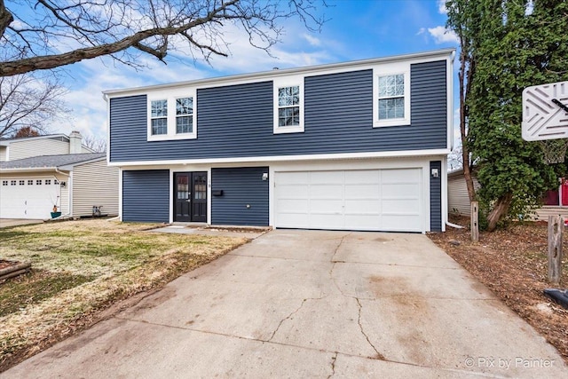 front of property featuring a garage and a front lawn