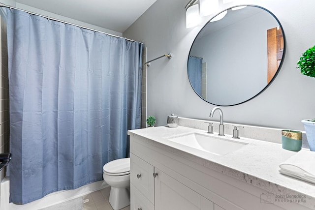 bathroom with vanity, toilet, and tile patterned flooring