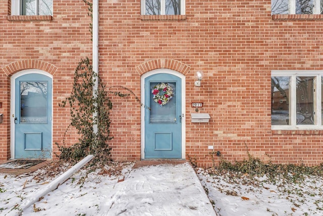 view of snow covered property entrance