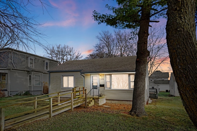 view of front of home with a yard