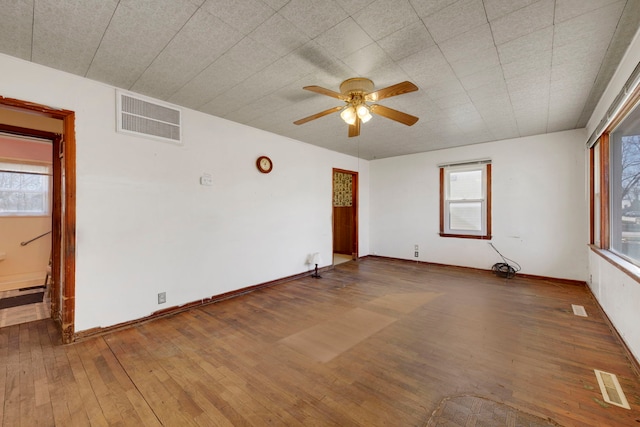 spare room featuring ceiling fan and wood-type flooring