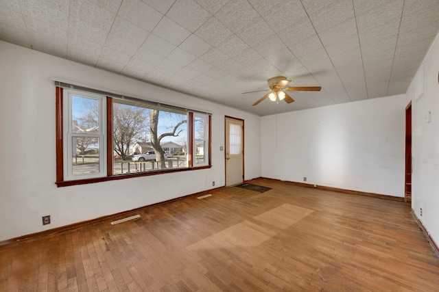 unfurnished room with light hardwood / wood-style flooring and ceiling fan