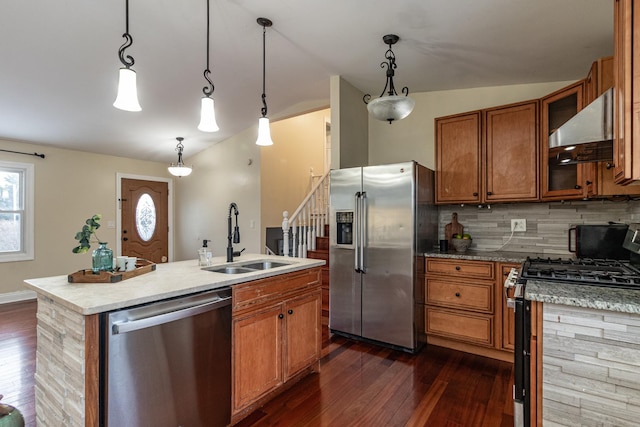 kitchen featuring sink, stainless steel appliances, ventilation hood, an island with sink, and lofted ceiling