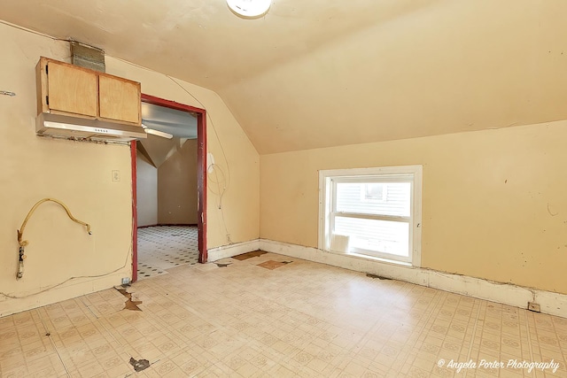 additional living space with vaulted ceiling