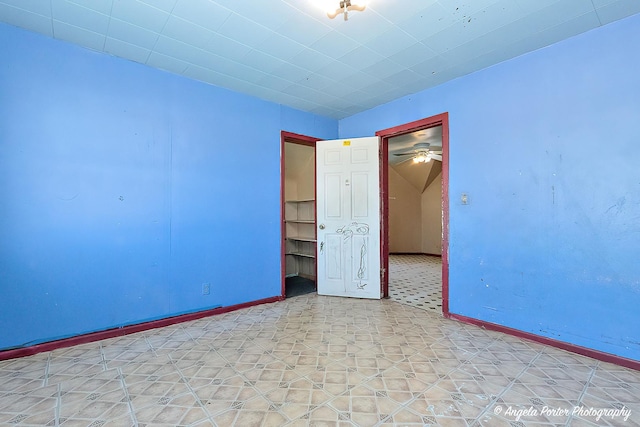 unfurnished room featuring ceiling fan