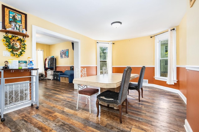 dining area featuring dark hardwood / wood-style floors