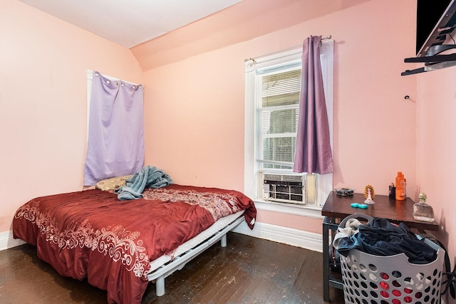 bedroom featuring cooling unit and dark hardwood / wood-style flooring