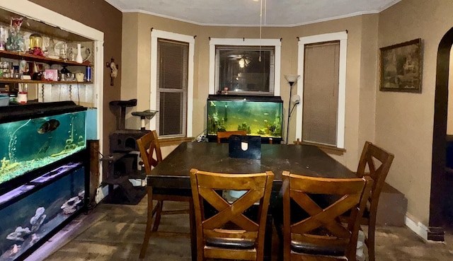 dining room featuring crown molding