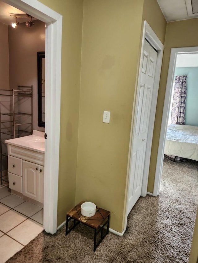 hallway with light colored carpet