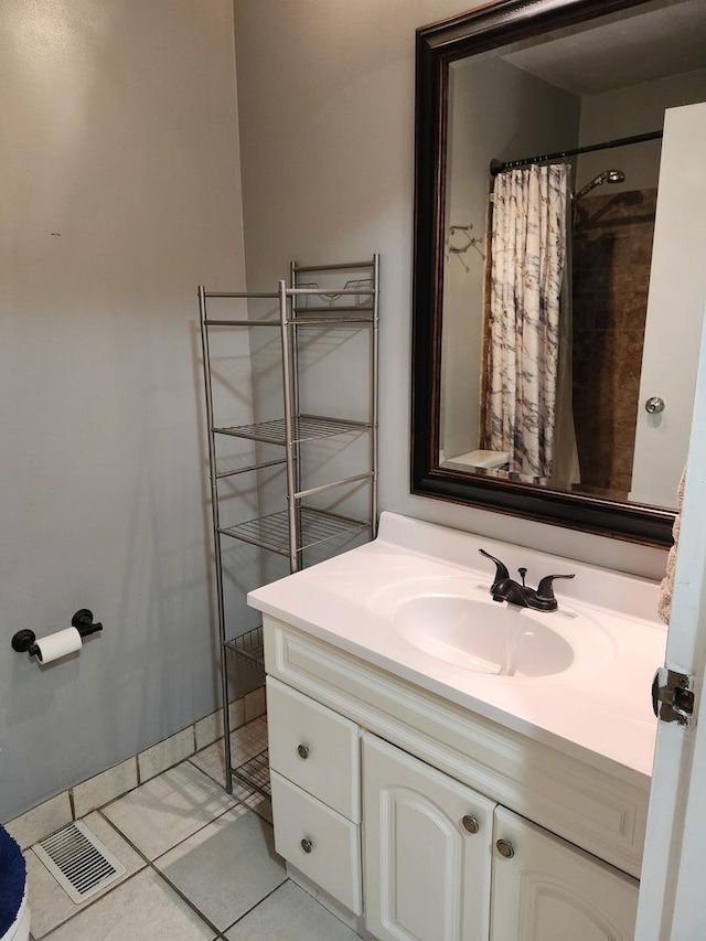 bathroom featuring tile patterned floors, a shower with curtain, and vanity