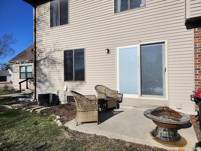 rear view of house featuring central AC and a patio area