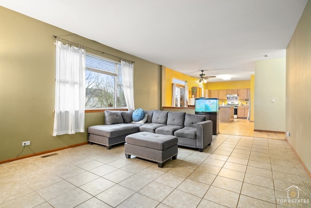 tiled living room featuring ceiling fan