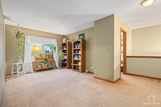 interior space featuring light colored carpet