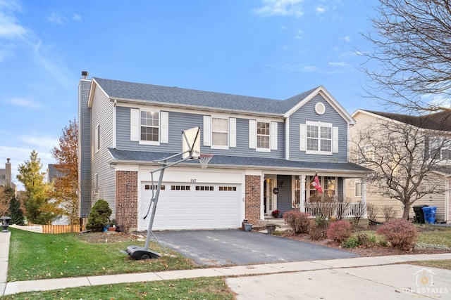 view of front of home featuring a porch and a garage