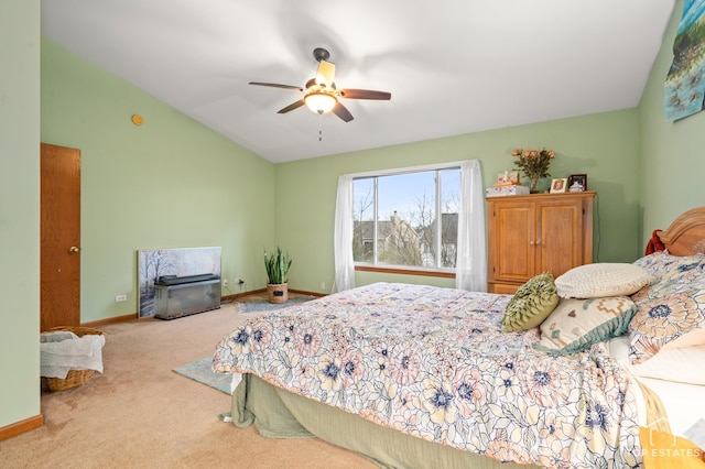 carpeted bedroom featuring vaulted ceiling and ceiling fan