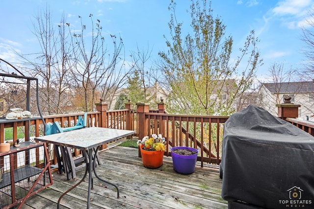 wooden deck with grilling area