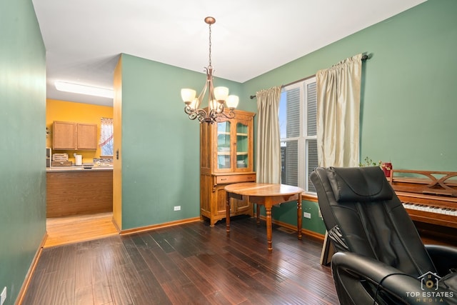 office space featuring dark hardwood / wood-style floors, a wealth of natural light, and an inviting chandelier