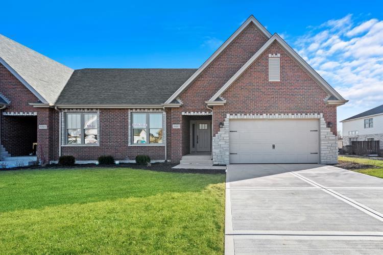 view of front of home with a garage and a front yard