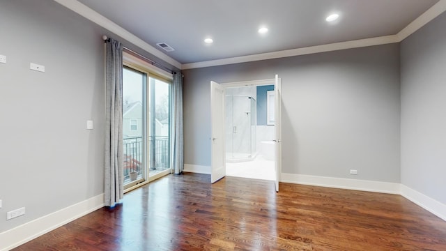 empty room with ornamental molding and dark wood-type flooring