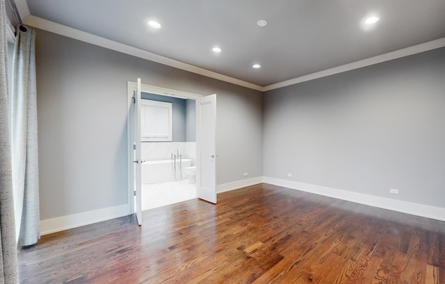 unfurnished room featuring hardwood / wood-style flooring and ornamental molding