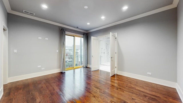 unfurnished room with dark hardwood / wood-style floors and ornamental molding