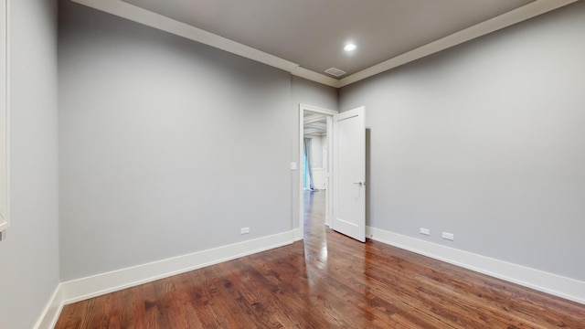 empty room with dark hardwood / wood-style flooring