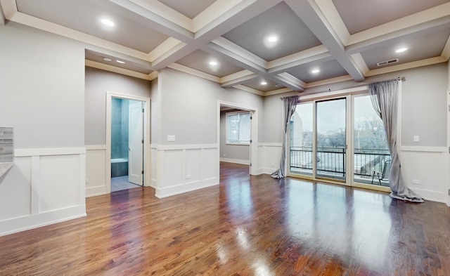 empty room featuring hardwood / wood-style floors, beamed ceiling, and coffered ceiling