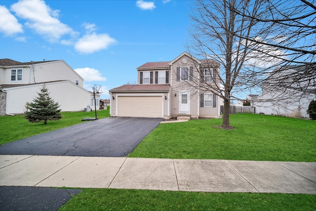 view of front facade featuring a front yard and a garage