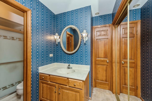 bathroom with vanity and toilet