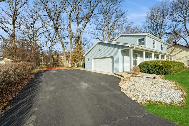 view of side of property featuring a garage