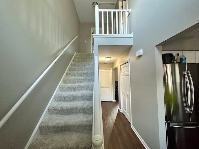 stairs with hardwood / wood-style floors