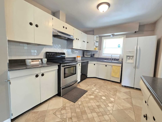 kitchen featuring stainless steel range with electric cooktop, white fridge with ice dispenser, black dishwasher, tasteful backsplash, and white cabinetry