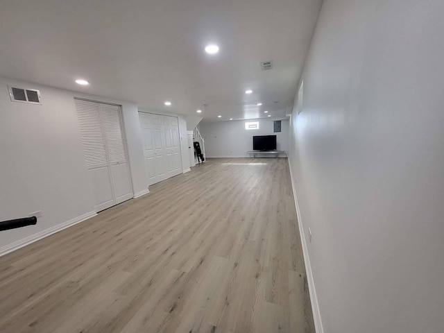 unfurnished living room with light hardwood / wood-style flooring